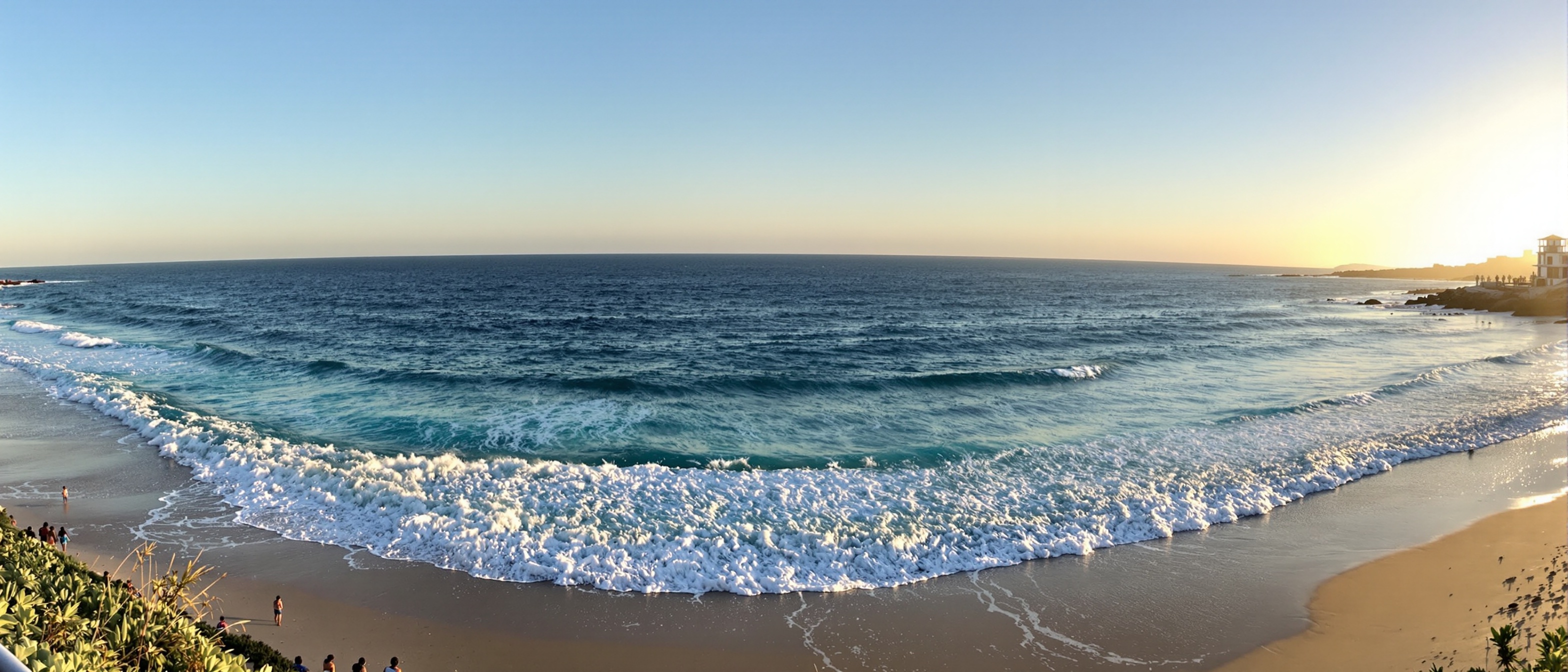 Bondi Beach at golden hour with turquoise water and white sand