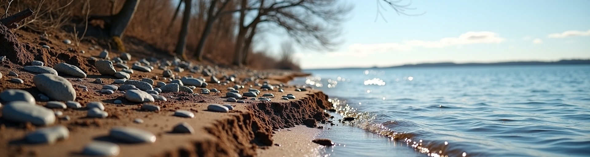 Michigan lakefront shoreline showing winter erosion damage in early spring requiring repair and restoration