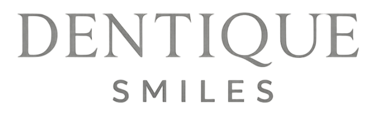 Dentique Smiles Logo