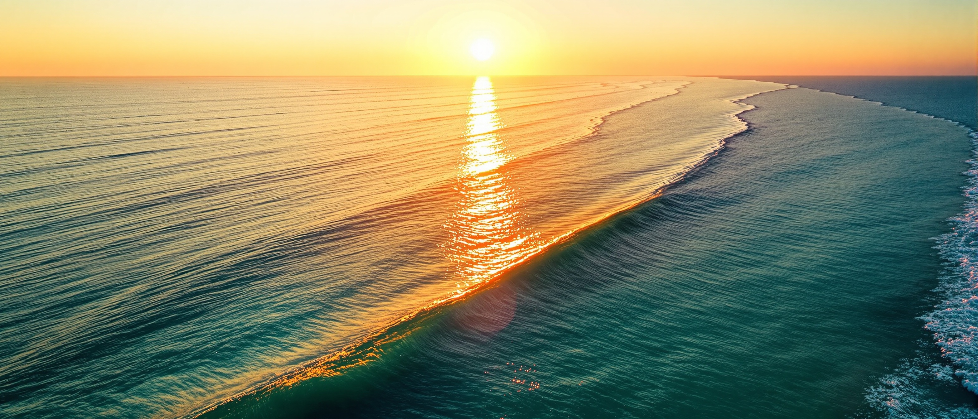 Sunrise over calm ocean water at golden hour — energy and healthy aging through NAD+ and peptide therapy