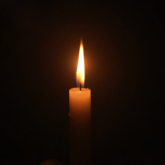 Candle flame in darkness