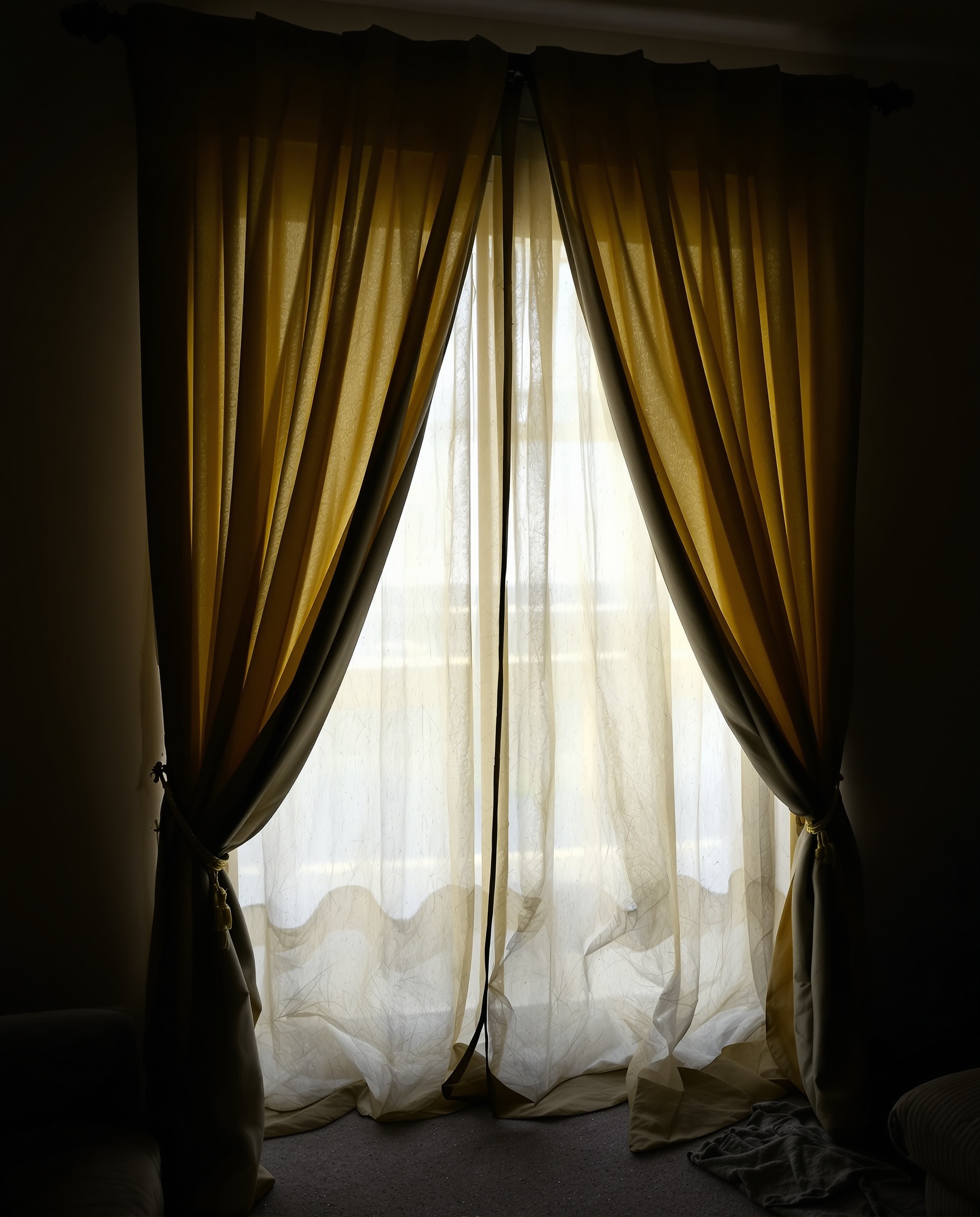 Drapery before professional cleaning — dusty and faded