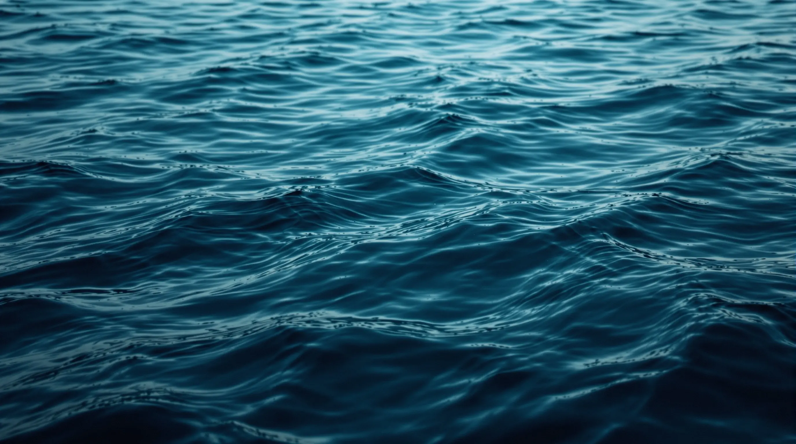 Dark moody abstract ocean background with deep navy and teal gradients for telehealth weight loss by state — Surfbound Health