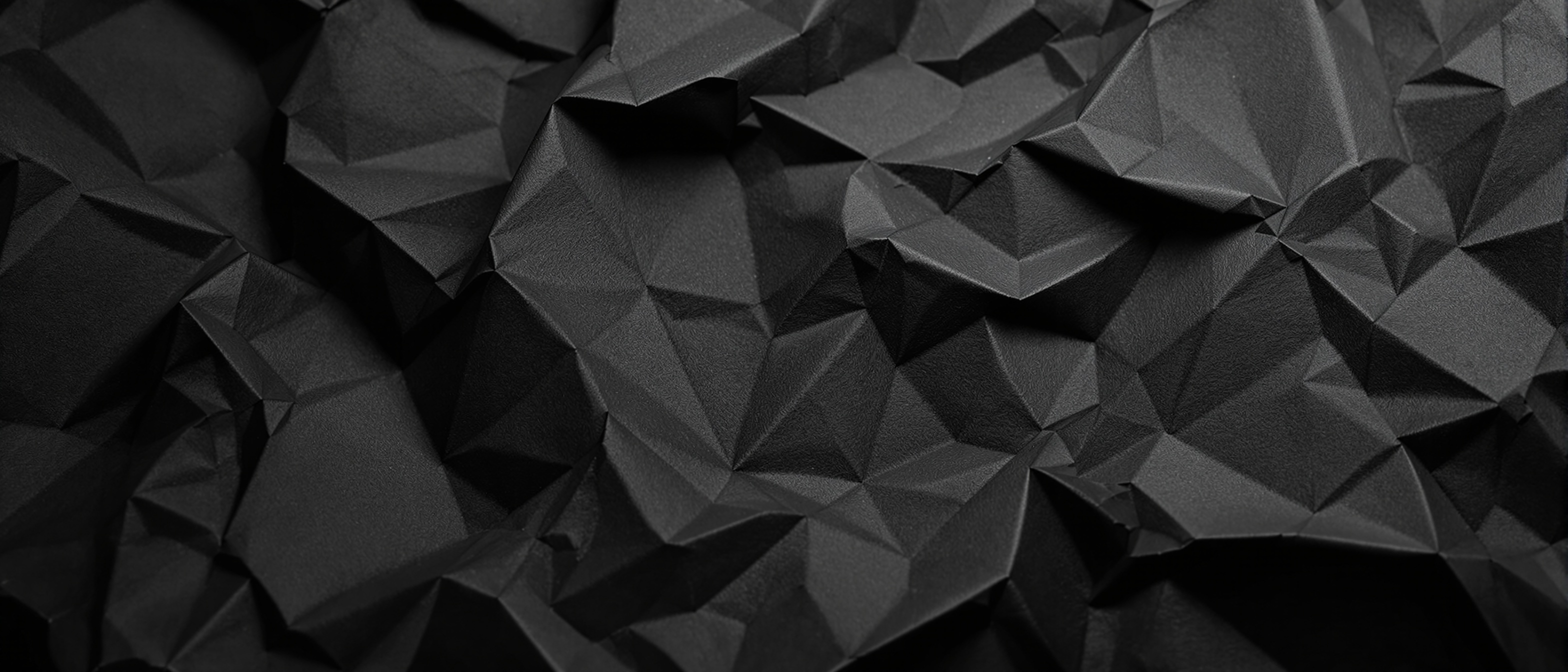 Crumpled dark paper texture background