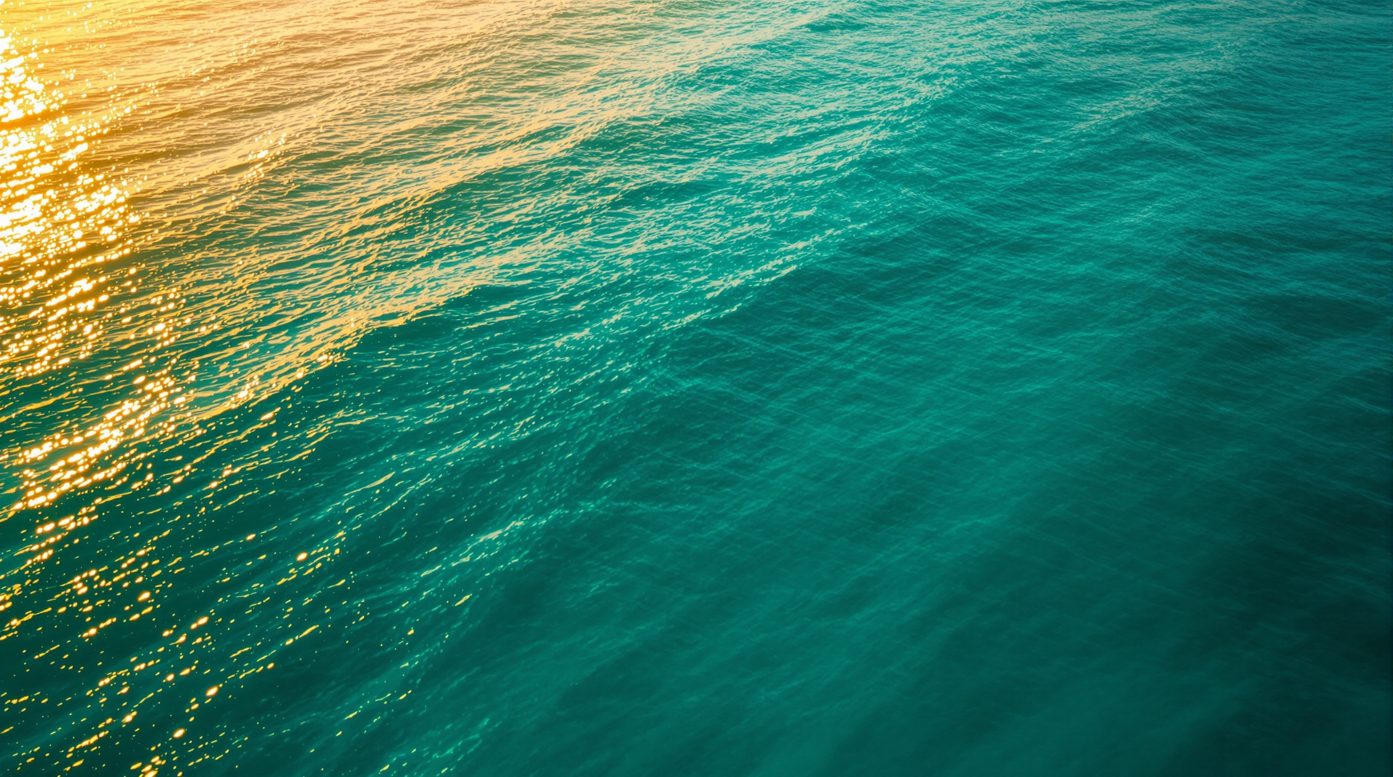 Aerial view of calm teal Gulf Coast ocean at golden hour — clinician-guided GLP-1 weight loss