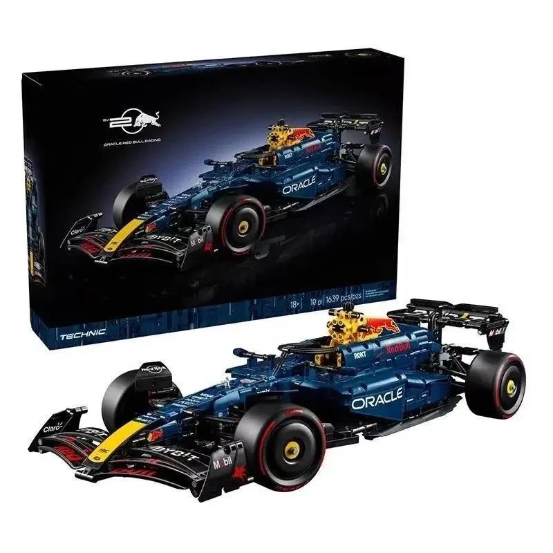 Original catalogue image: dark-blue, yellow and red racing-car block model with illustrated box. The image itself does not display the selected price or a physical length measurement.